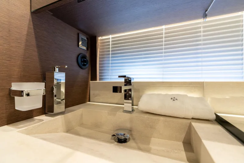 Slide: The Image of Luxurious bathroom sink in 2022 Prestige 520 yacht, featuring modern fixtures and elegant design. - 48