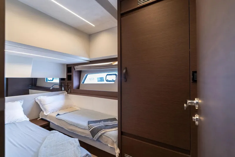 Slide: The Image of Luxurious cabin interior of 2022 Prestige 520 yacht with twin beds and modern design. - 49