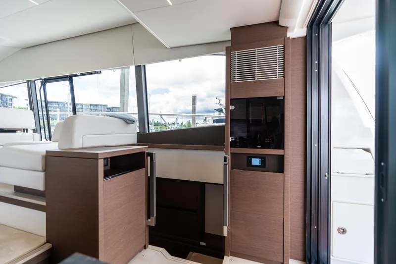 Slide: The Image of Interior of 2022 Prestige 520 yacht, featuring modern design and luxurious seating. - 6