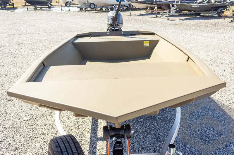 Slide: The Image of 2026 G3 Gator Tough 1652 VBW boat on trailer, gravel lot background. - 12