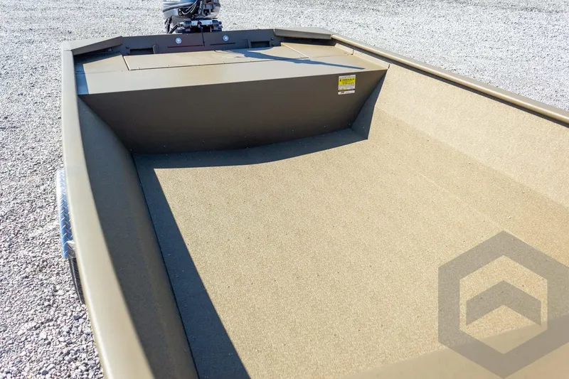 Slide: The Image of 2026 G3 Gator Tough 1652 VBW boat interior with motor, on gravel surface. - 20