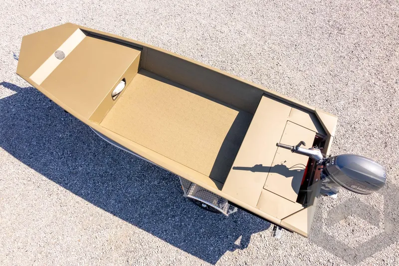 Slide: The Image of 2026 G3 Gator Tough 1652 VBW boat on gravel, top view, with outboard motor. - 33