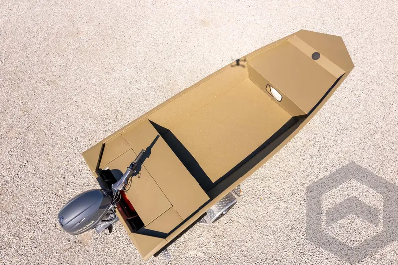 Slide: The Image of 2026 G3 Gator Tough 1652 VBW boat, aerial view, on gravel surface. - 35