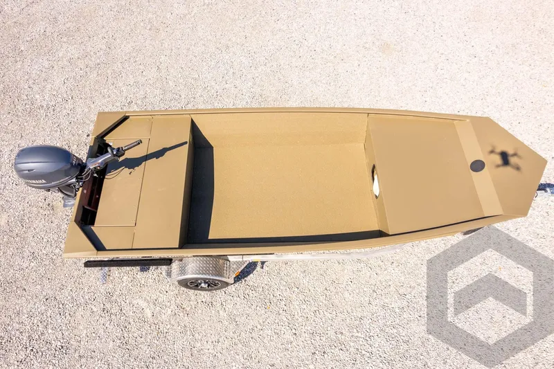 Slide: The Image of 2026 G3 Gator Tough 1652 VBW boat, aerial view, on gravel surface. - 36