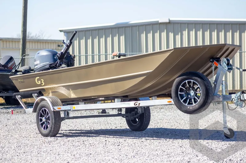 Slide: The Image of 2026 G3 Gator Tough 1652 VBW boat on trailer, outdoors, side view. - 4