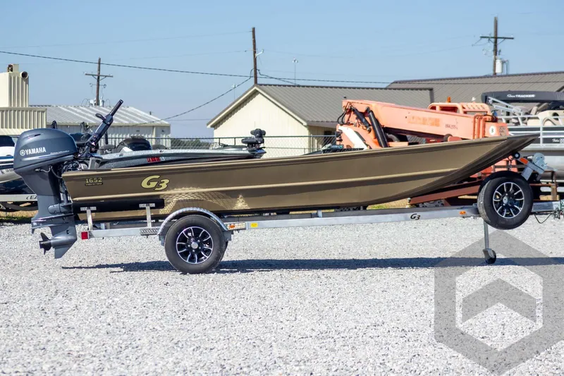 Slide: The Image of 2026 G3 Gator Tough 1652 VBW boat on trailer, featuring Yamaha outboard motor. - 6
