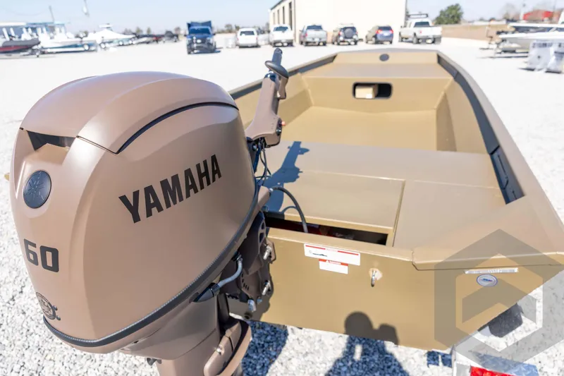 Slide: The Image of 2026 G3 Gator Tough 1860 VBW boat with Yamaha 60 engine, parked outdoors. - 15