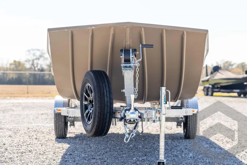 Slide: The Image of 2026 G3 Gator Tough 1860 VBW boat on trailer, front view, parked outdoors. - 2