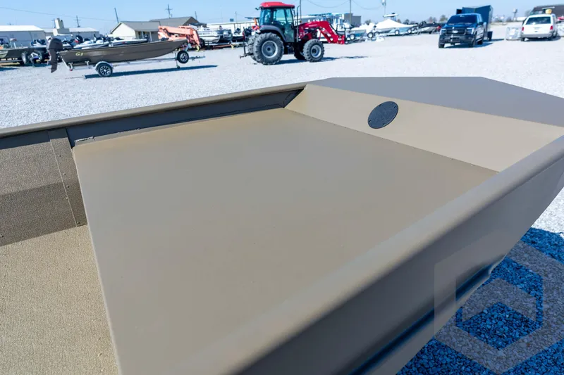 Slide: The Image of 2026 G3 Gator Tough 1860 VBW boat displayed outdoors on gravel lot. - 24