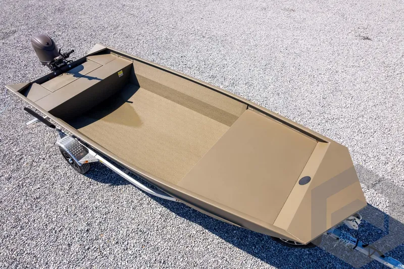 Slide: The Image of 2026 G3 Gator Tough 1860 VBW boat on trailer, gravel background. - 28