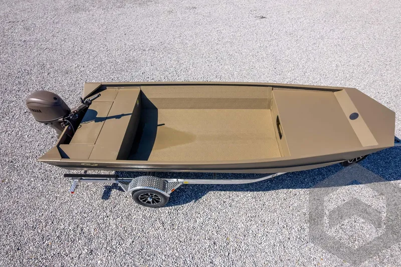 Slide: The Image of 2026 G3 Gator Tough 1860 VBW boat on trailer, gravel background. - 29