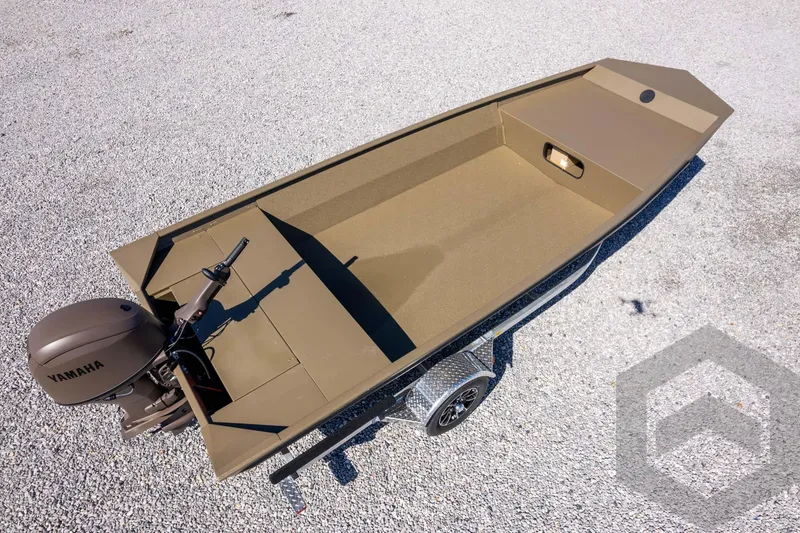 Slide: The Image of 2026 G3 Gator Tough 1860 VBW boat with Yamaha motor on gravel surface. - 30