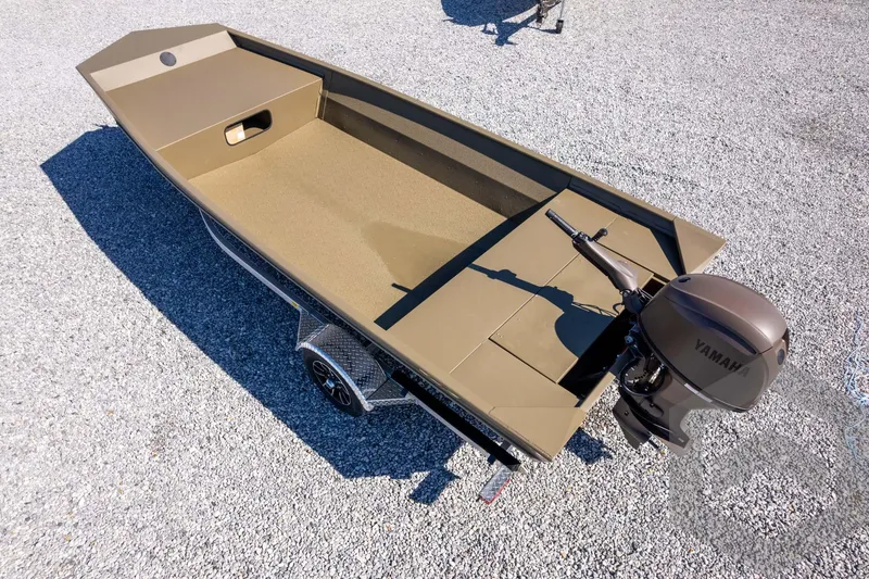 Slide: The Image of 2026 G3 Gator Tough 1860 VBW boat with Yamaha motor on gravel surface. - 32