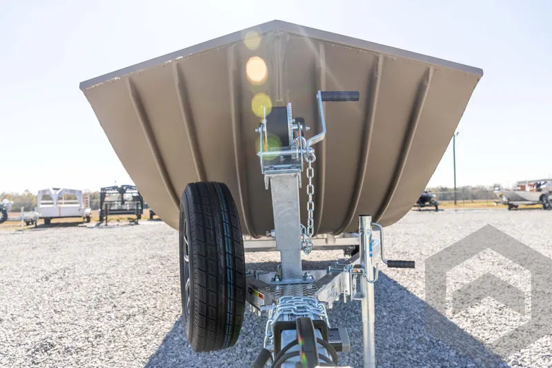 Slide: The Image of 2026 G3 Gator Tough 1860 VBW boat on trailer, gravel lot background. - 9
