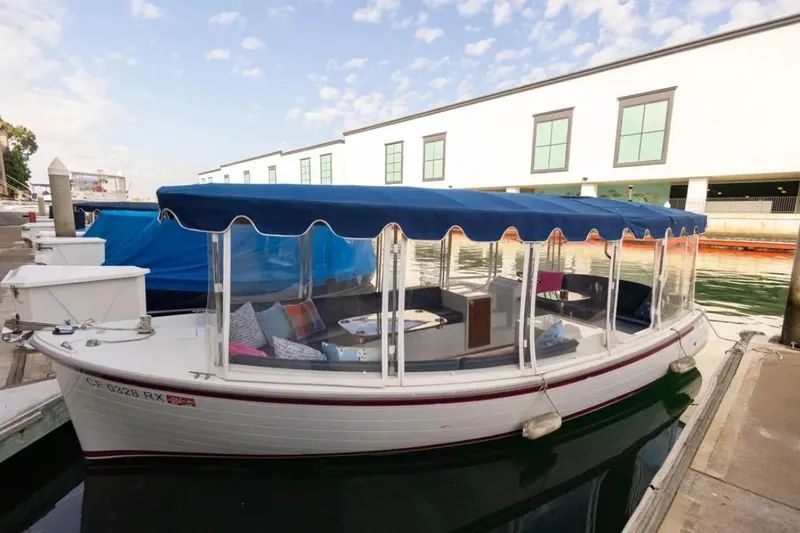 Slide: The Image of 2014 Duffy 22 Bay Island boat with new windows, surrey top, battery system, and flooring. - 1