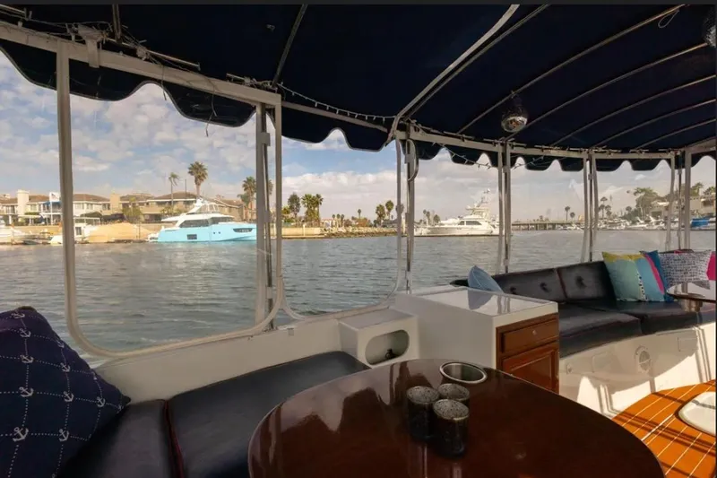 Slide: The Image of 2014 Duffy 22 Bay Island electric boat with blue canopy, fully upgraded features. - 3