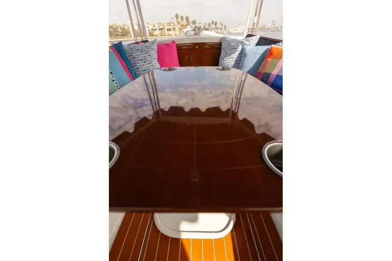 Slide: The Image of 2014 Duffy 22 Bay Island boat docked with blue canopy and colorful cushions. - 6