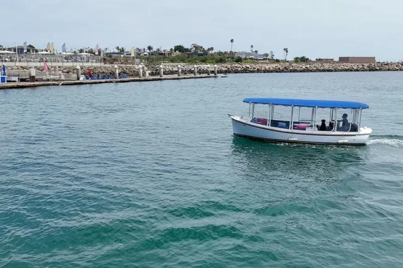 Slide: The Image of Luxurious interior of a 2014 Duffy 22 Bay Island boat with polished wood and colorful cushions. - 7