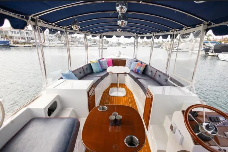 Slide: The Image of Interior view of a 2014 Duffy 22 Bay Island boat with waterfront scenery. - 8