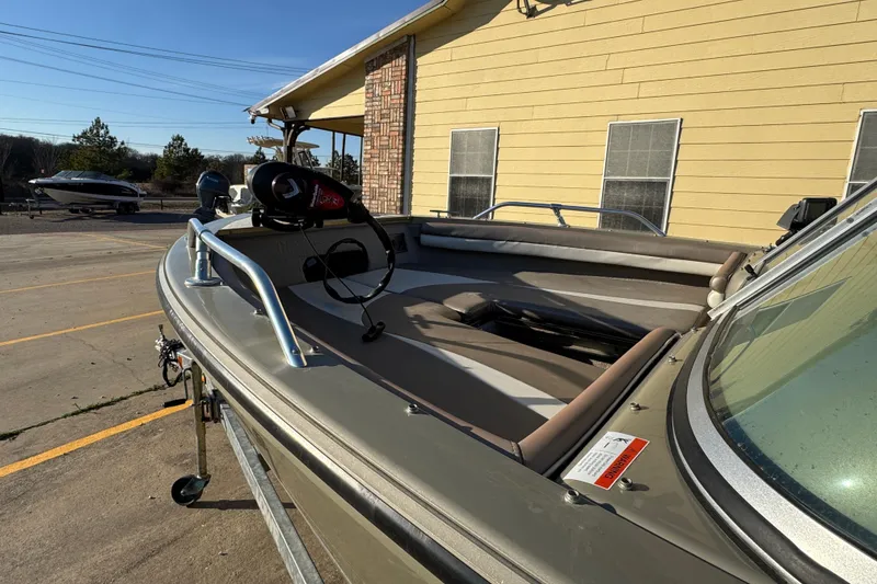 Slide: The Image of 2007 Lowe Fish & Ski 175 boat parked near a yellow building on a sunny day. - 5