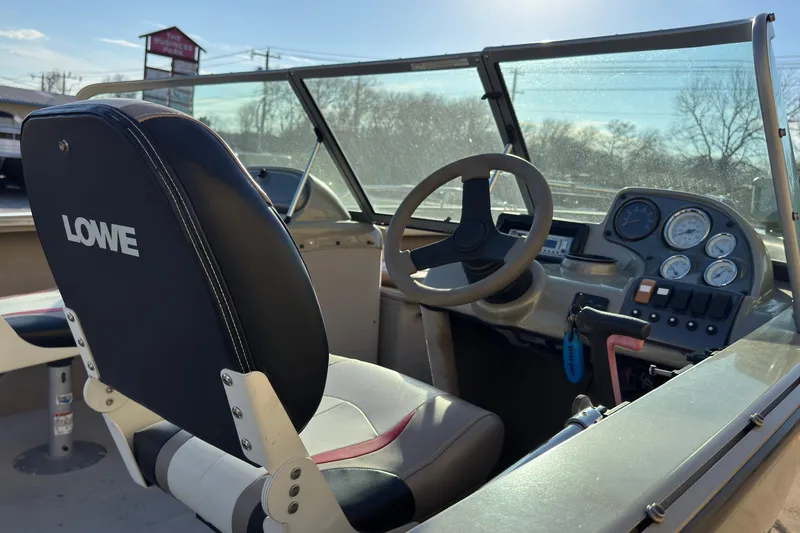 Slide: The Image of 2007 Lowe Fish & Ski 175 boat interior with steering wheel and dashboard controls. - 7