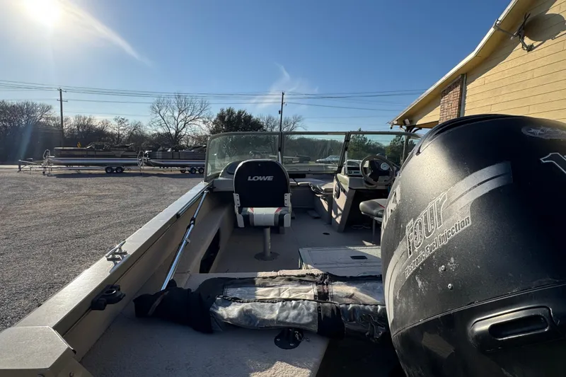 Slide: The Image of 2007 Lowe Fish & Ski 175 boat with outboard motor in sunny outdoor setting. - 9