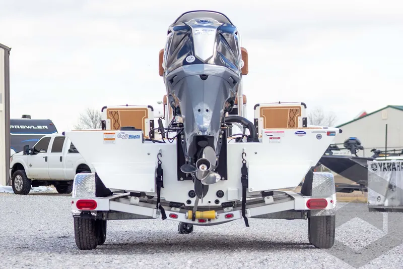 Slide: The Image of 2026 G3 Bay 22 GX boat on trailer, rear view with outboard motor. - 10