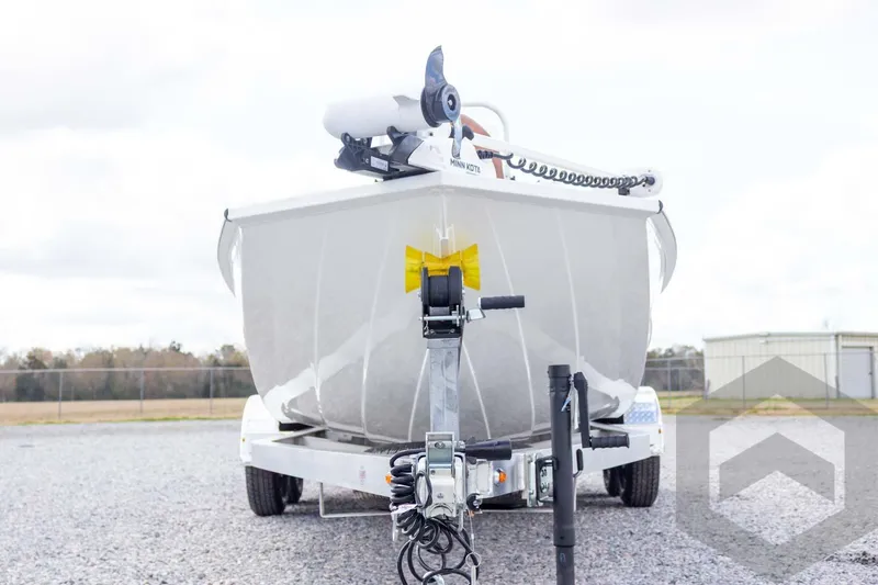 Slide: The Image of 2026 G3 Bay 22 GX boat on trailer, front view, outdoors. - 13