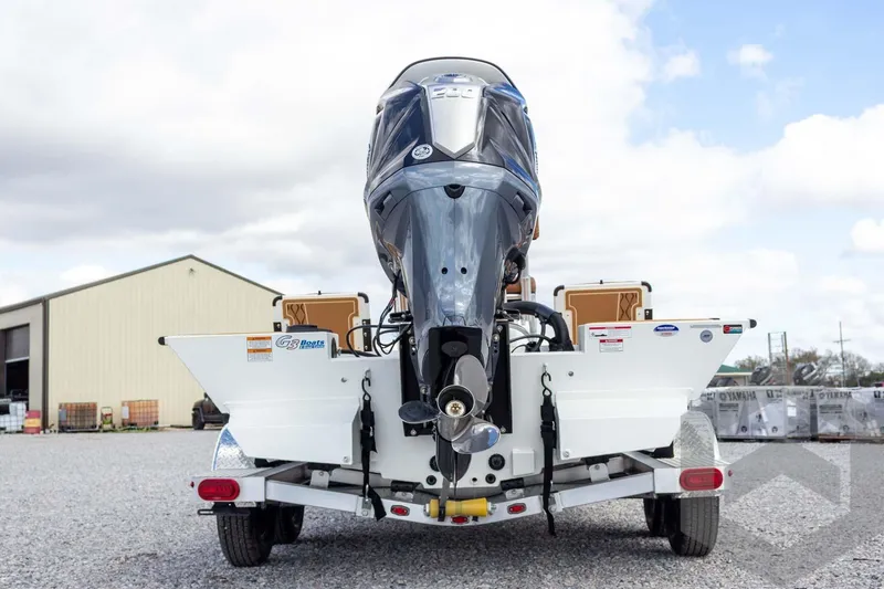 Slide: The Image of 2026 G3 Bay 22 GX boat on trailer, rear view with outboard motor. - 18