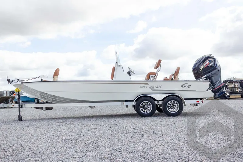 Slide: The Image of 2026 G3 Bay 22 GX boat on trailer, featuring sleek design and powerful outboard motor. - 20