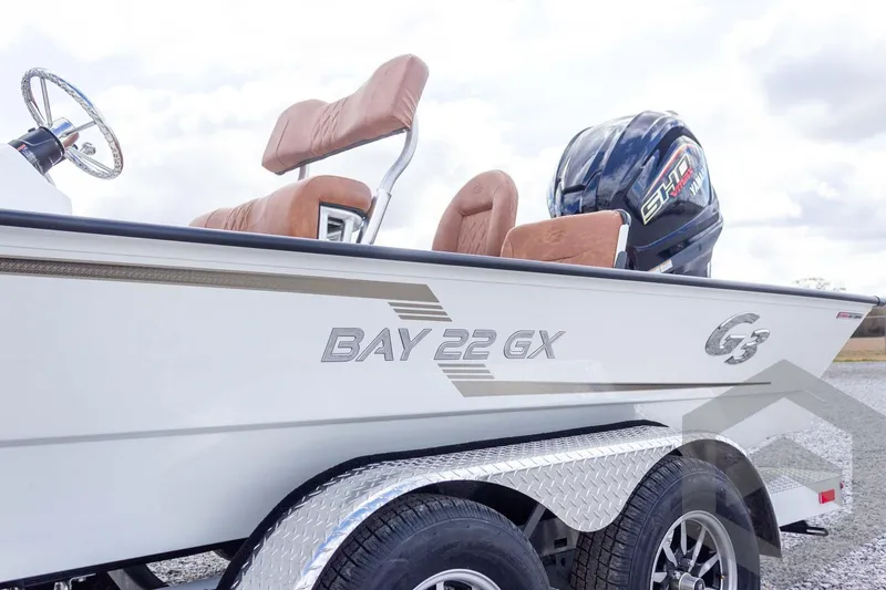 Slide: The Image of 2026 G3 Bay 22 GX boat with Yamaha engine on a trailer. - 21