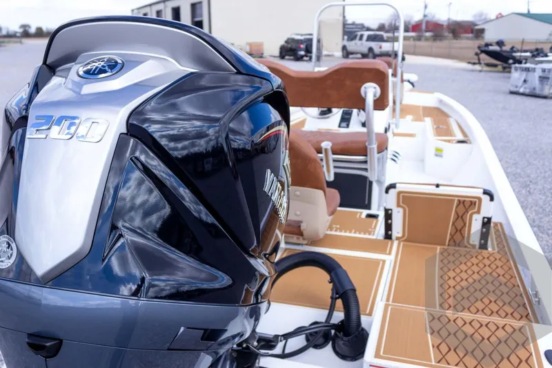 Slide: The Image of 2026 G3 Bay 22 GX boat with Yamaha 200 engine, featuring stylish deck design. - 22