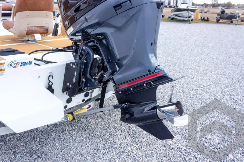 Slide: The Image of 2026 G3 Bay 22 GX boat with powerful outboard motor on gravel surface. - 24