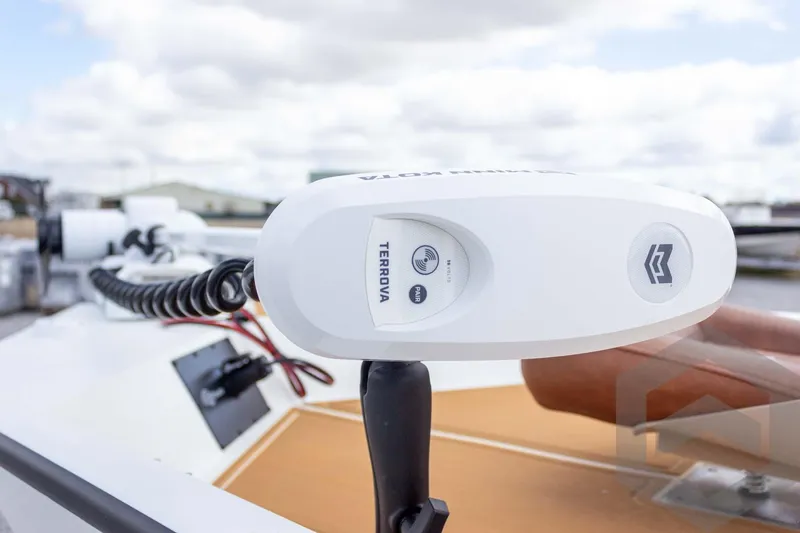 Slide: The Image of 2026 G3 Bay 22 GX boat with Terrova trolling motor, close-up view. - 26