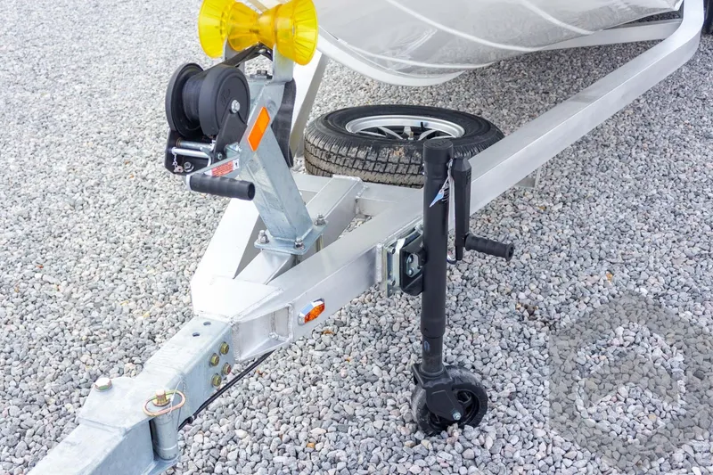 Slide: The Image of Trailer hitch and wheel assembly of 2026 G3 Bay 22 GX on gravel surface. - 28