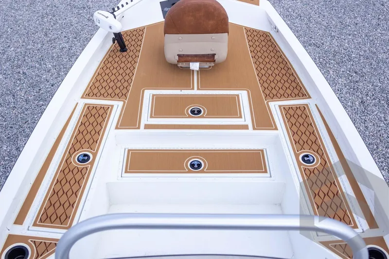 Slide: The Image of 2026 G3 Bay 22 GX boat deck with brown diamond-patterned flooring and seating. - 31