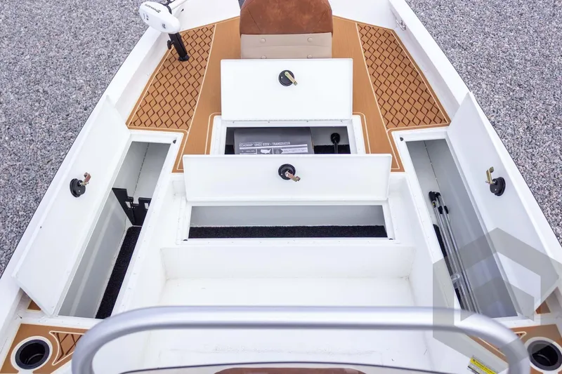 Slide: The Image of 2026 G3 Bay 22 GX boat storage compartments with open hatches, showcasing ample space. - 32