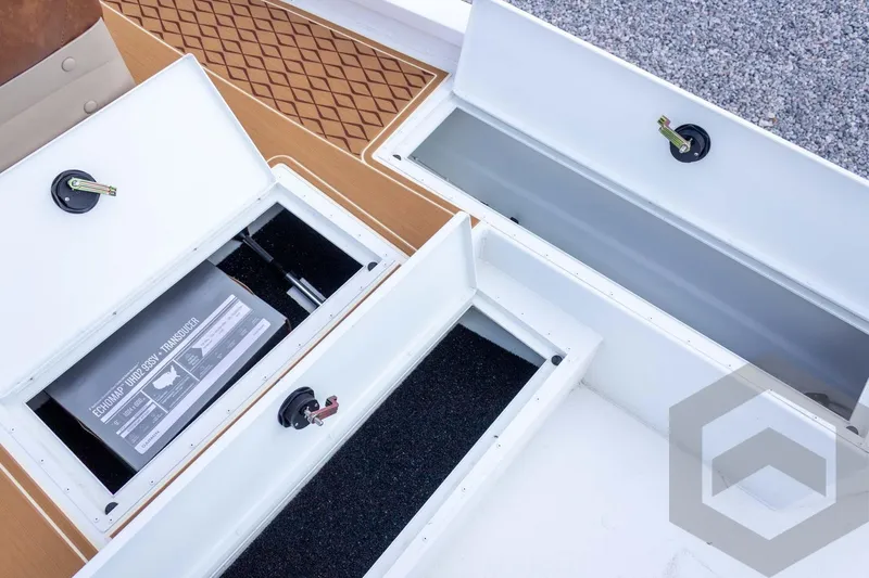 Slide: The Image of Open storage compartments on 2026 G3 Bay 22 GX boat deck. - 34
