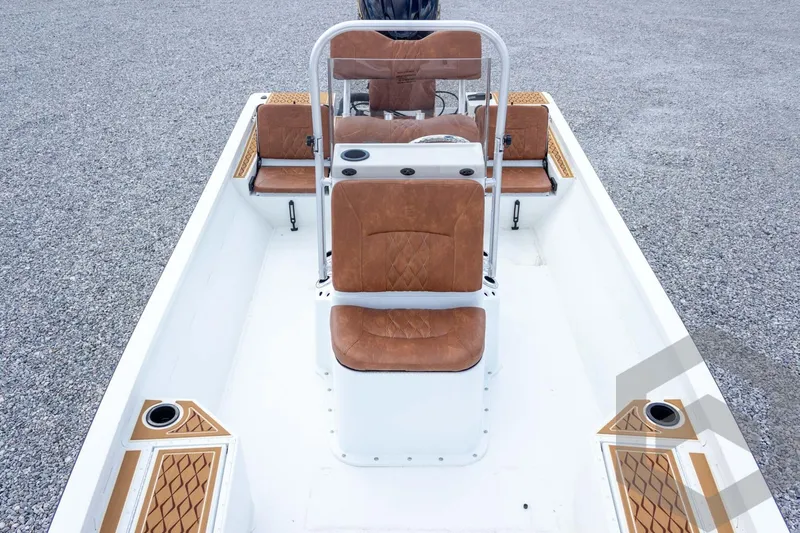 Slide: The Image of 2026 G3 Bay 22 GX boat interior with brown cushioned seats and white deck. - 37