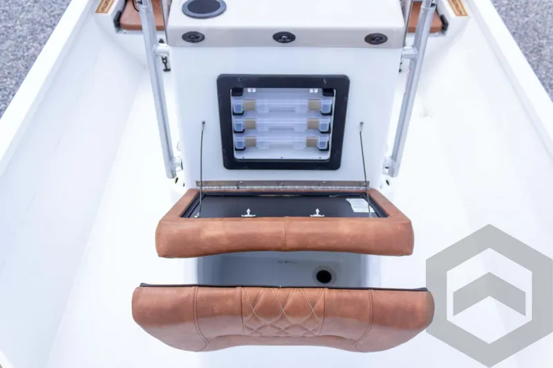 Slide: The Image of 2026 G3 Bay 22 GX boat interior with storage compartment and cushioned seating. - 39