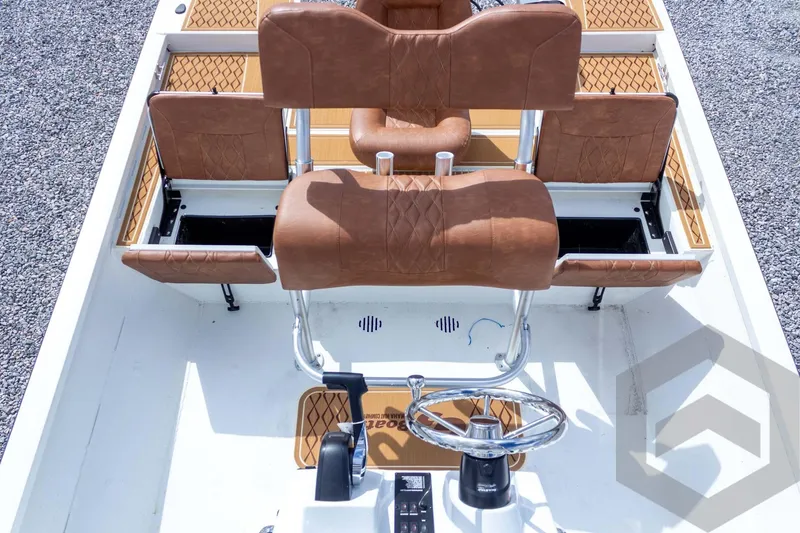 Slide: The Image of 2026 G3 Bay 22 GX boat interior with brown leather seats and steering wheel. - 43