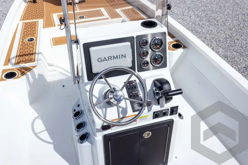 Slide: The Image of 2026 G3 Bay 22 GX boat console with Garmin navigation and steering wheel. - 45