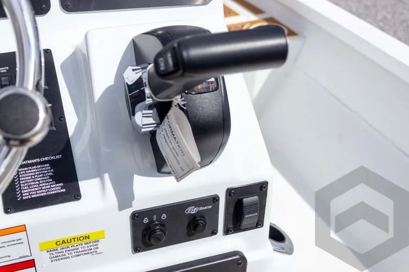 Slide: The Image of Control panel of 2026 G3 Bay 22 GX boat with throttle and caution labels. - 49