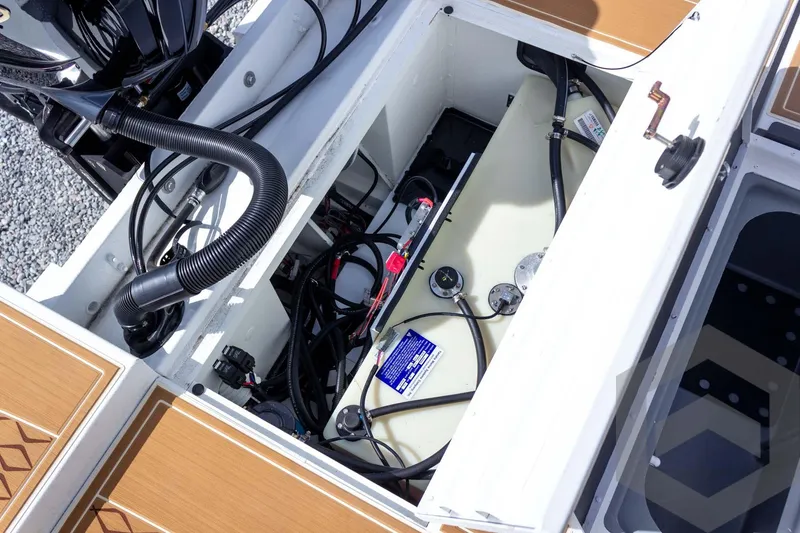 Slide: The Image of 2026 G3 Bay 22 GX boat interior showing engine compartment and wiring. - 54