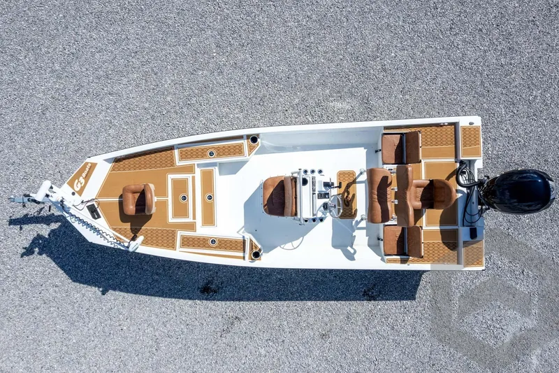 Slide: The Image of 2026 G3 Bay 22 GX boat, aerial view, brown seating, white deck, outboard motor. - 56
