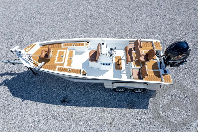 Slide: The Image of 2026 G3 Bay 22 GX boat on trailer, featuring brown seating and modern design. - 59
