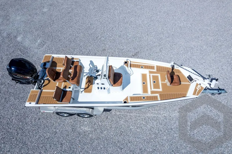 Slide: The Image of 2026 G3 Bay 22 GX boat on trailer, aerial view, brown seating, outboard motor. - 63