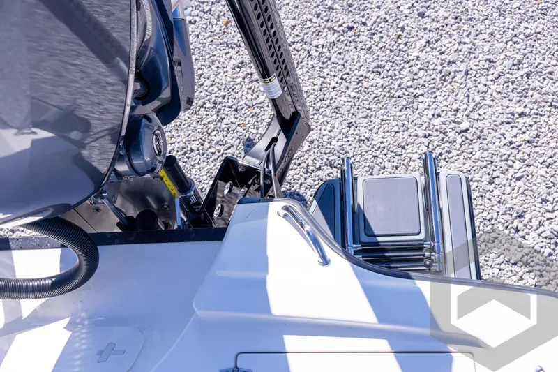 Slide: The Image of 2026 Pathfinder 2500 Hybrid boat engine and ladder on gravel background. - 100