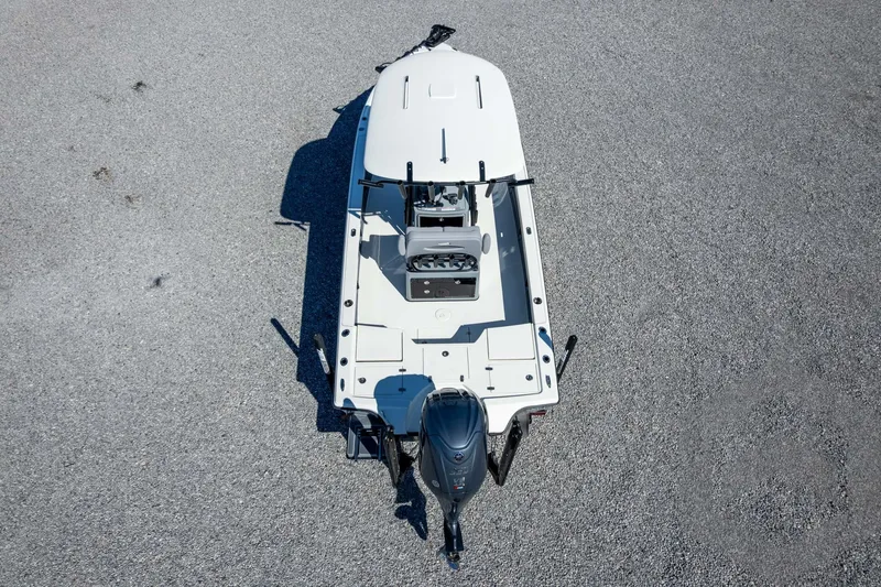 Slide: The Image of Top view of a 2026 Pathfinder 2500 Hybrid boat on gravel surface. - 102