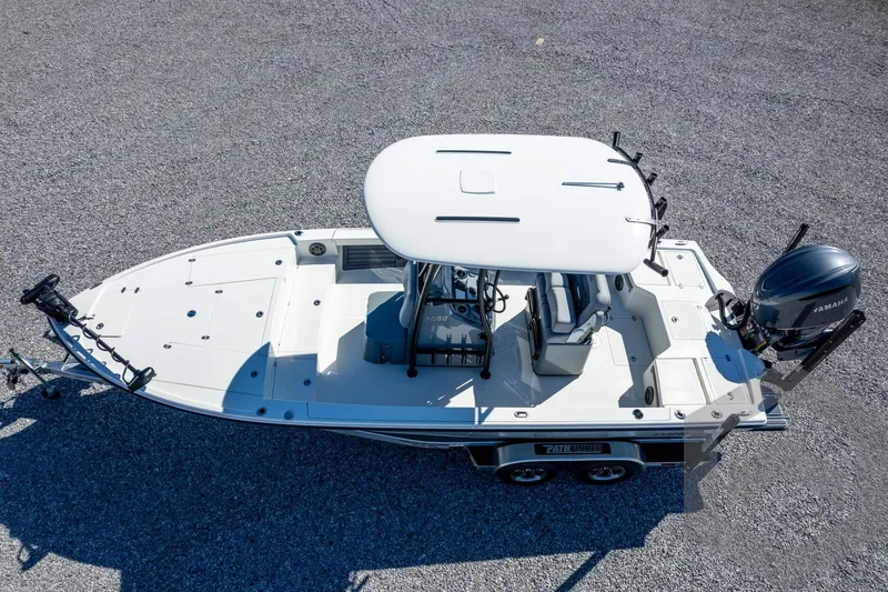 Slide: The Image of 2026 Pathfinder 2500 Hybrid boat, aerial view, featuring Yamaha outboard motor. - 104
